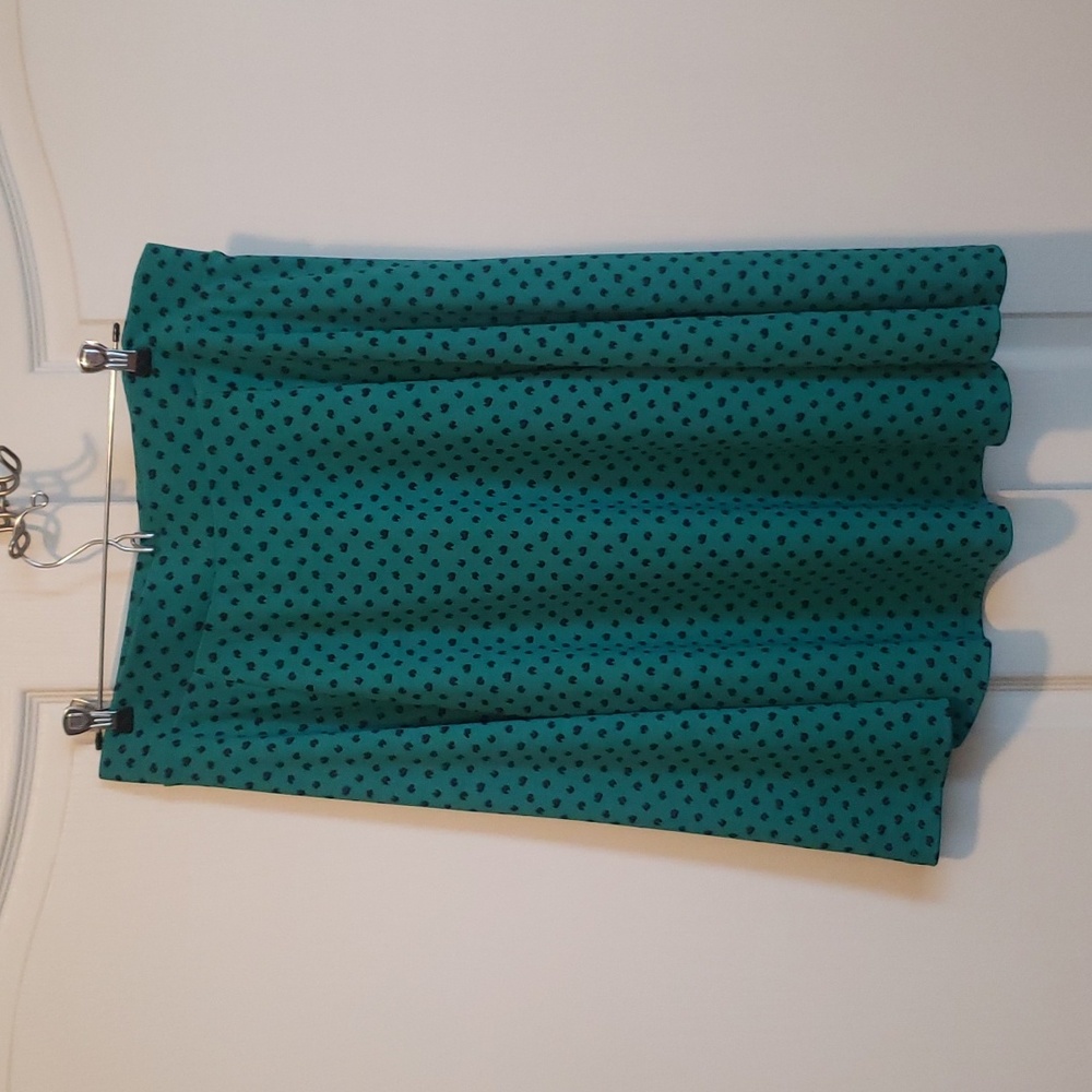 Never worn A-line green skirt. Falls at knee.
